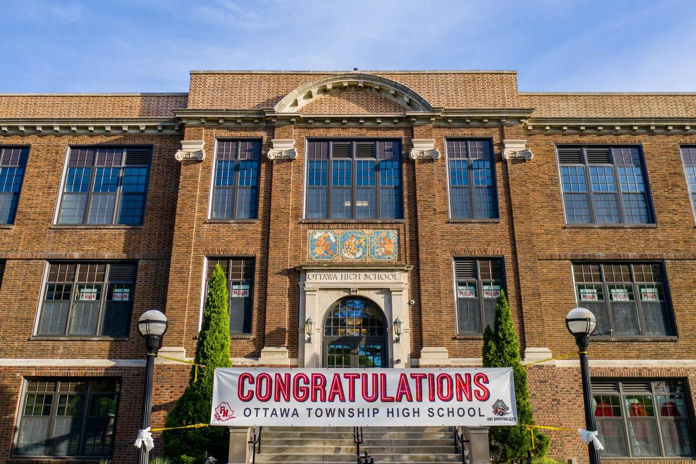 Ottawa Township High School entrance with a Congratulations banner